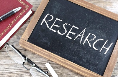 Chalkboard with the word research written on it
