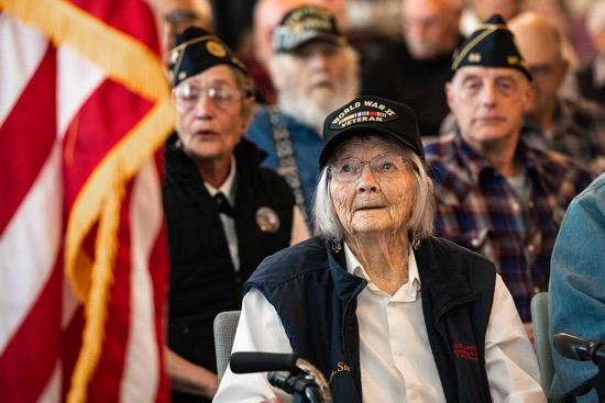 Older veterans Elderly veterans seated in audience at event