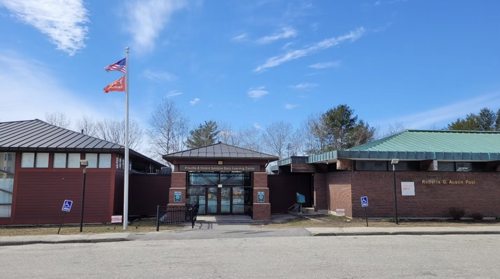 Maine learning center Maine learning center brick building with flag out front