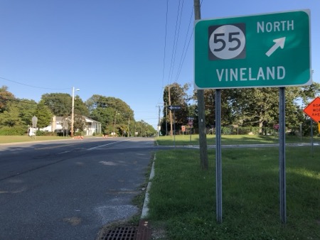 Vineland NJ sign on Route 49 Traffic sign points right towards Vineland along Route 49