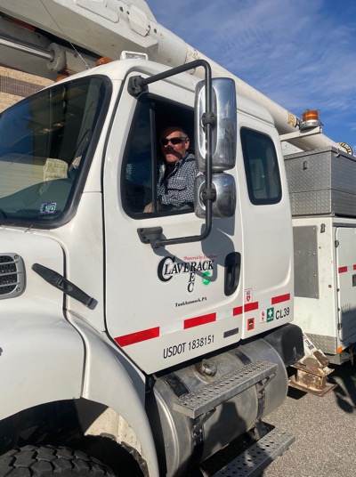 Claverack REC & Revolution truck with employee behind the wheel
