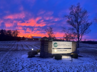 Claverack REC sign at dusk with a gorgeous orange and deep purple sky