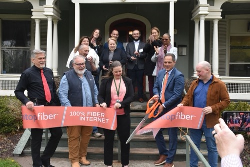 A dozen local and state officials cut red ribbon for Sullivan County Fiber network 