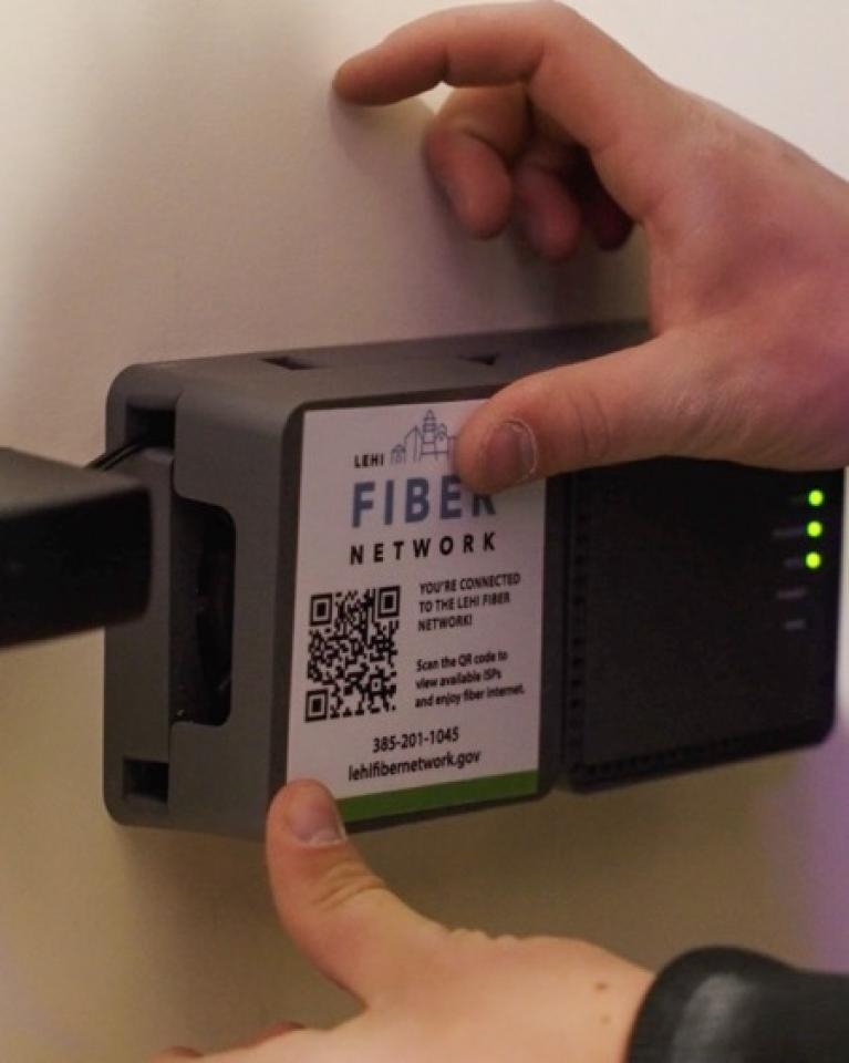 An ONT against the wall inside a home enables fiber connectivity