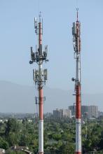 Wireless towers buildings in background