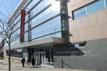 The front of the glass-walled New York Public Library Center in the Bronx 